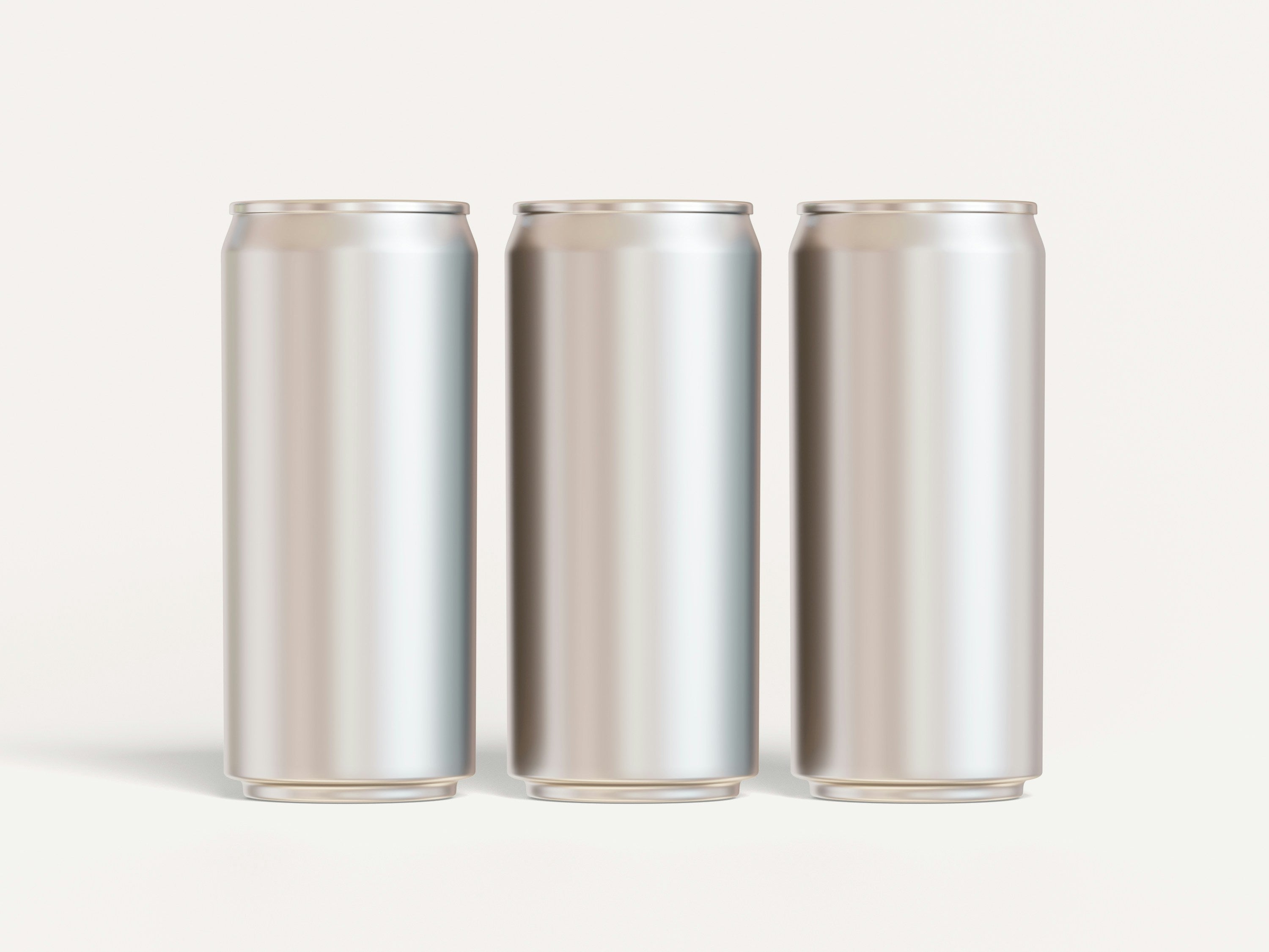Tre umerkede beholdere i aluminium – et materiale Concept Zero utforsker i arbeidet med mer sirkulær emballasje. Foto: Ambo Ampeng / Unsplash.